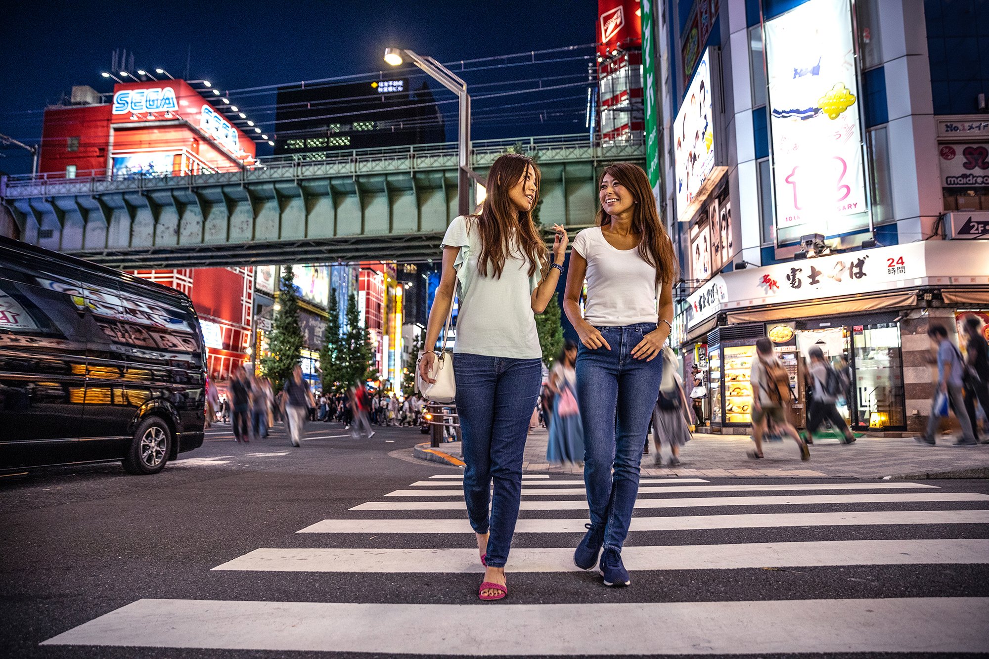 Japanese Friends Walking In Akihabara Tokyo Leonardo Patrizi